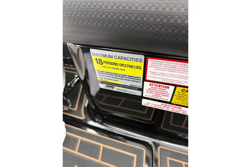 Slide: The Image of 2019 Centurion Ri257 capacity label, maximum 18 persons or 2700 lbs, safety warnings visible. - 22