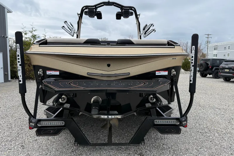 Slide: The Image of 2019 Centurion Ri257 boat rear view with sleek design and advanced features. - 7