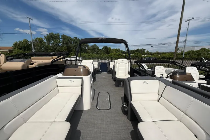 Slide: The Image of 2022 Manitou Aurora LE pontoon boat with spacious seating and modern design. - 3
