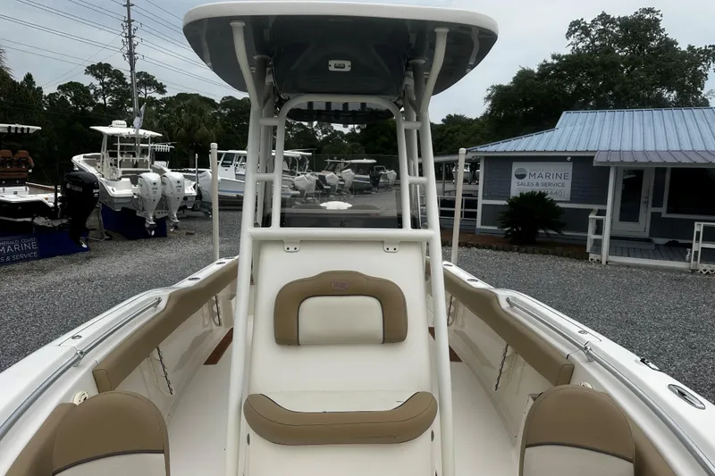 Slide: The Image of 2019 Key West 239 FS boat at a marine sales lot, showcasing interior seating. - 12