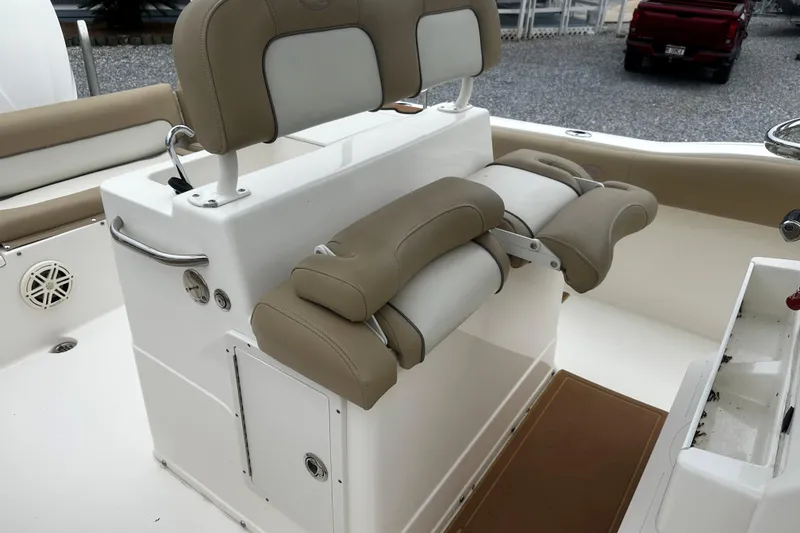 Slide: The Image of 2019 Key West 239 FS boat interior with beige and white seating. - 7
