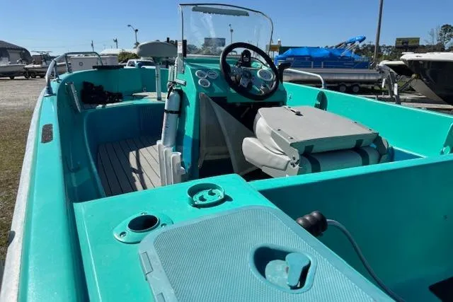 Slide: The Image of 1971 Chrysler 15 CC boat with turquoise interior and steering console. - 10