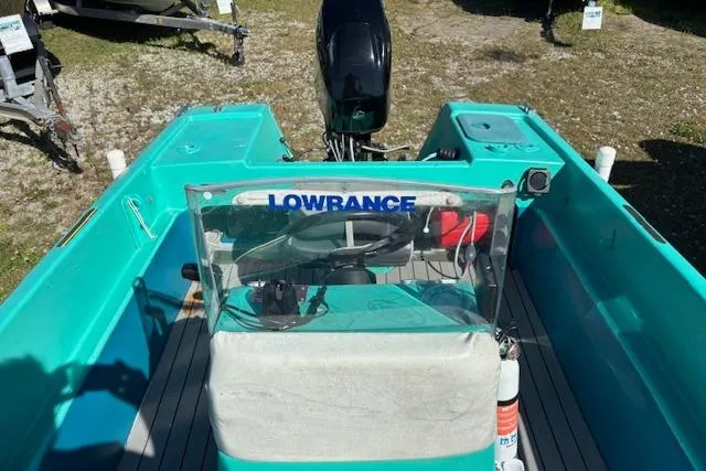 Slide: The Image of 1971 Chrysler 15 CC boat with turquoise interior and Lowrance equipment. - 12