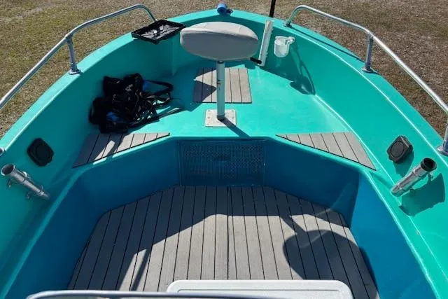 Slide: The Image of 1971 Chrysler 15 CC boat interior with teal deck and seating. - 14