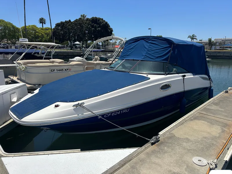 Slide: The Image of 2014 Sea Ray 260 Sundeck boat docked at marina. - 12