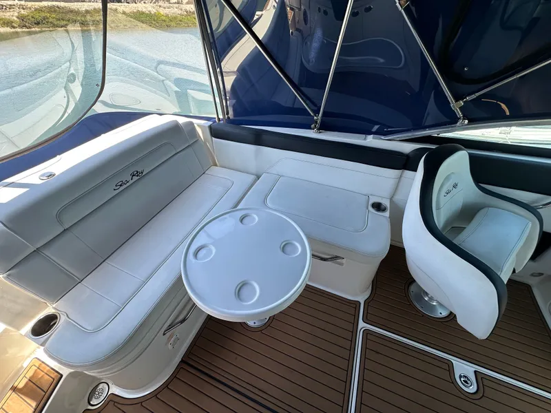 Slide: The Image of Interior of 2014 Sea Ray 260 Sundeck with seating and table. - 14