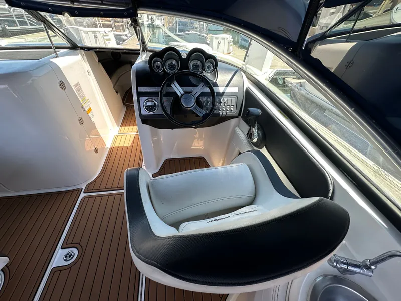 Slide: The Image of Interior of a 2014 Sea Ray 260 Sundeck boat with helm station. - 15