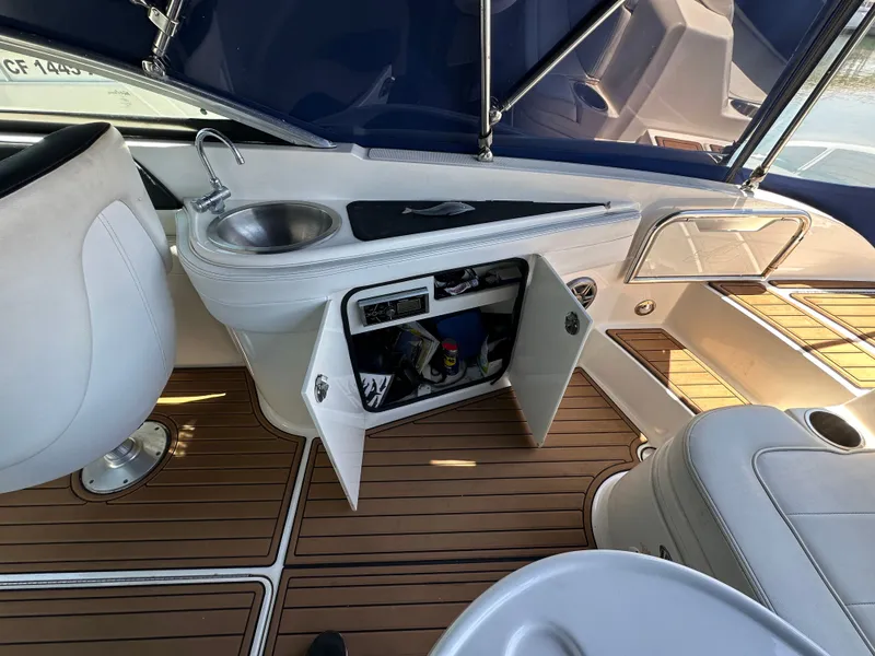 Slide: The Image of Interior of a 2014 Sea Ray 260 Sundeck with sink and storage. - 21