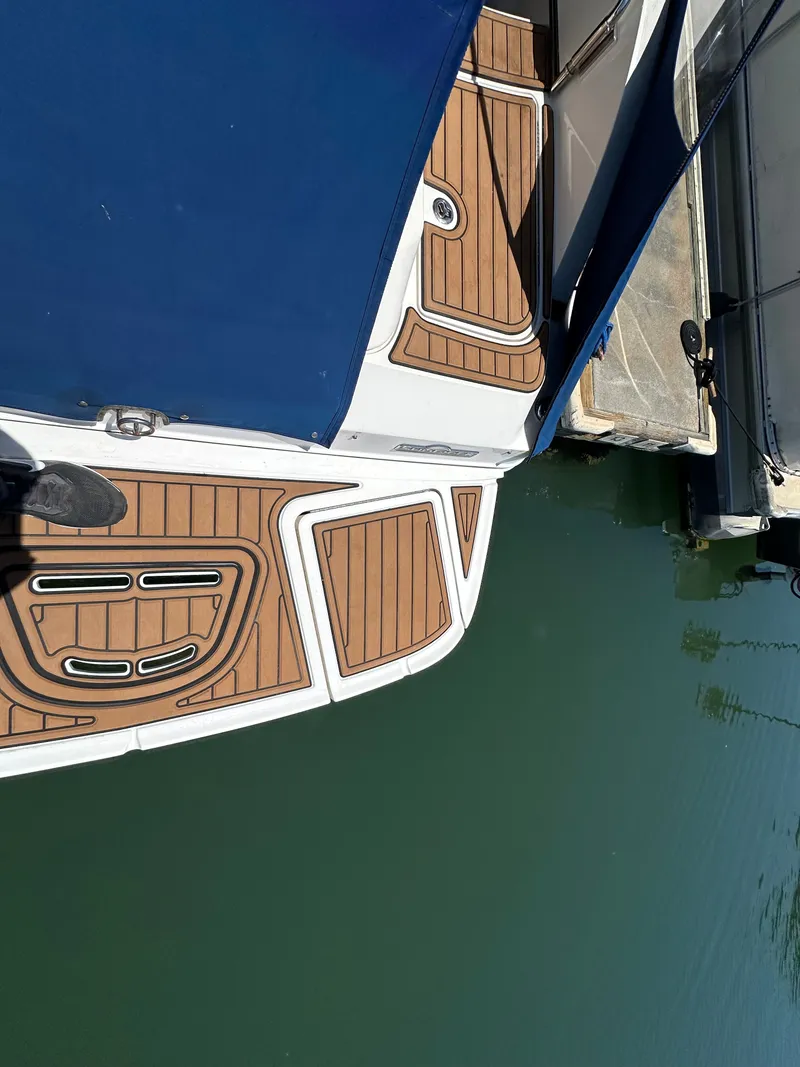 Slide: The Image of 2014 Sea Ray 260 Sundeck at dock with teak deck. - 23