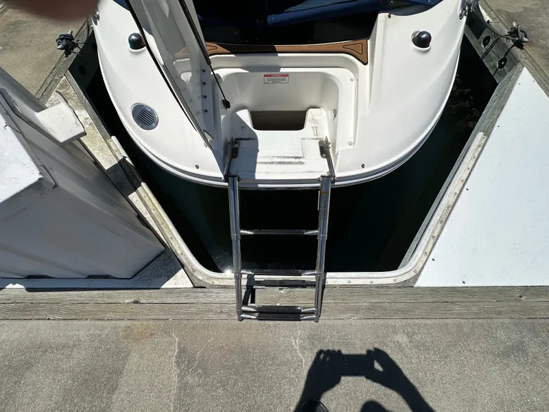 Slide: The Image of Rear view of a 2014 Sea Ray 260 Sundeck with swim ladder. - 26