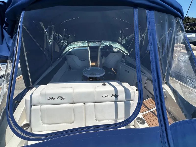 Slide: The Image of Interior view of a 2014 Sea Ray 260 Sundeck with blue cover. - 28