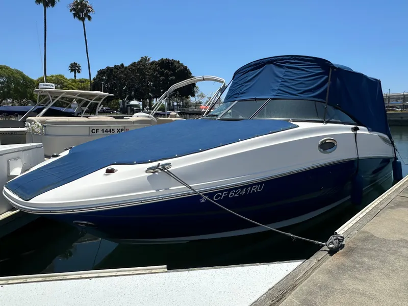 Slide: The Image of 2014 Sea Ray 260 Sundeck boat docked at marina. - 30