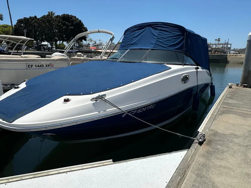 Slide: The Image of 2014 Sea Ray 260 Sundeck boat docked at marina. - 31