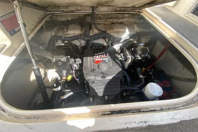 Slide: The Image of 2005 Rinker Fiesta Vee 250 engine compartment with Mercury 350 MAG MPI engine. - 12