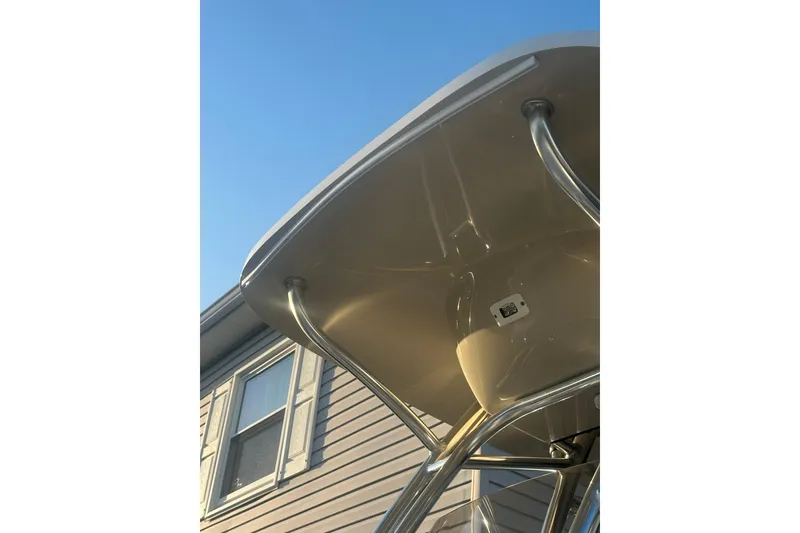 Slide: The Image of 2024 Key West 244 Center Console boat canopy against a clear blue sky. - 10