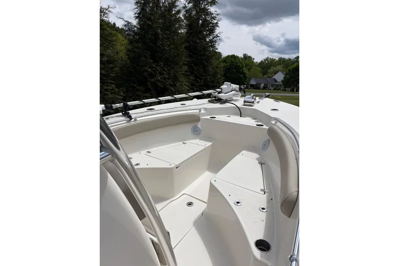 Slide: The Image of 2024 Key West 244 Center Console boat interior with seating and fishing rod holders. - 4