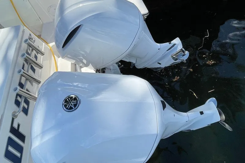 Slide: The Image of 2016 Pursuit OS 325 Offshore boat with dual Yamaha outboard engines. - 8