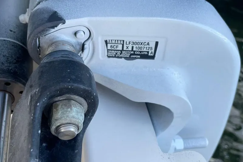 Slide: The Image of Close-up of Yamaha LF300XCA engine part on 2016 Pursuit OS 325 Offshore boat. - 9