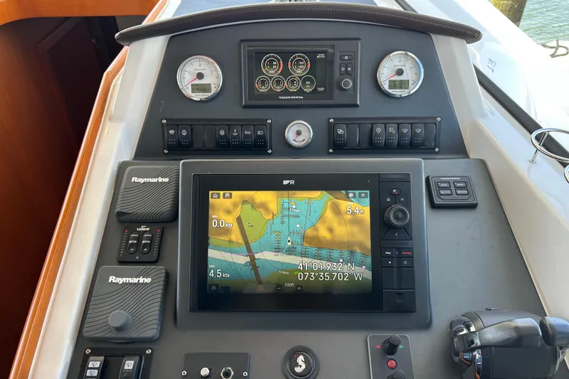 Slide: The Image of Control panel of a 2018 Beneteau Swift Trawler 44 with navigation and monitoring systems. - 15