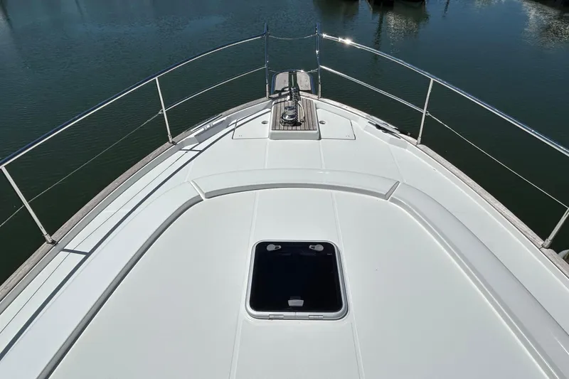 Slide: The Image of 2018 Beneteau Swift Trawler 44 deck view, showcasing sleek design and railing details. - 30