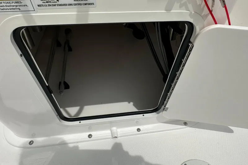 Slide: The Image of Open storage compartment on 2026 Bayliner Trophy T18 boat, showcasing interior space. - 20