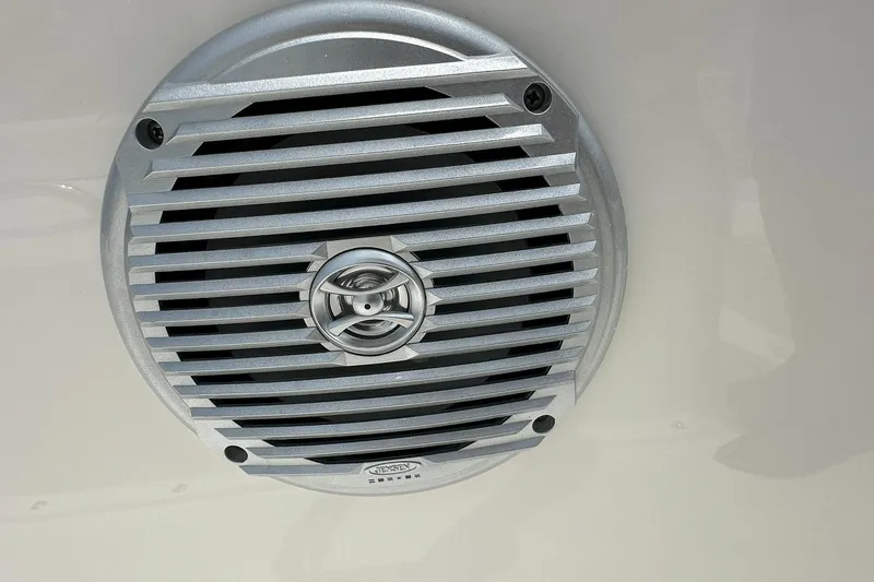 Slide: The Image of Speaker grille on 2026 Bayliner Trophy T18 boat, featuring a sleek, metallic design. - 23