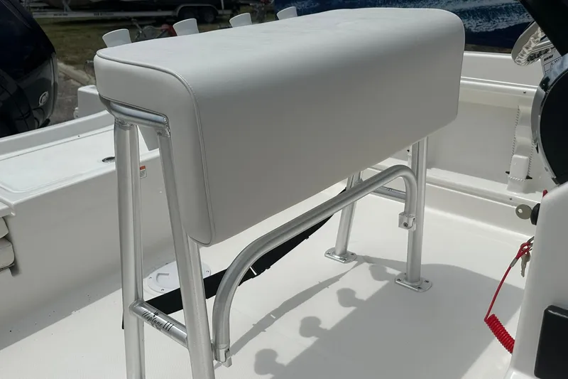 Slide: The Image of 2026 Bayliner Trophy T18 boat seat with sleek white upholstery and sturdy metal frame. - 29