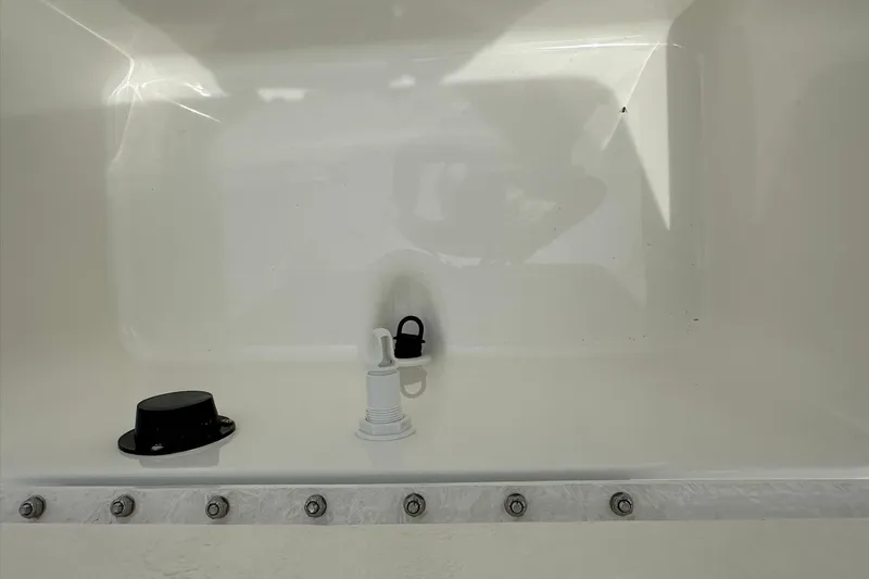 Slide: The Image of Interior view of 2026 Bayliner Trophy T18 boat compartment with fittings. - 33
