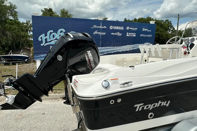 Slide: The Image of 2026 Bayliner Trophy T18 boat with Mercury engine, displayed outdoors. - 37