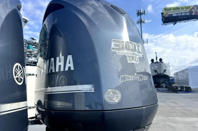 Slide: The Image of Yamaha 300 V6 outboard engines on a 2012 Contender 35 LS boat. - 10