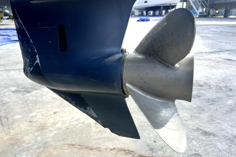 Slide: The Image of Close-up of a 2012 Contender 35 LS boat propeller on a concrete surface. - 11