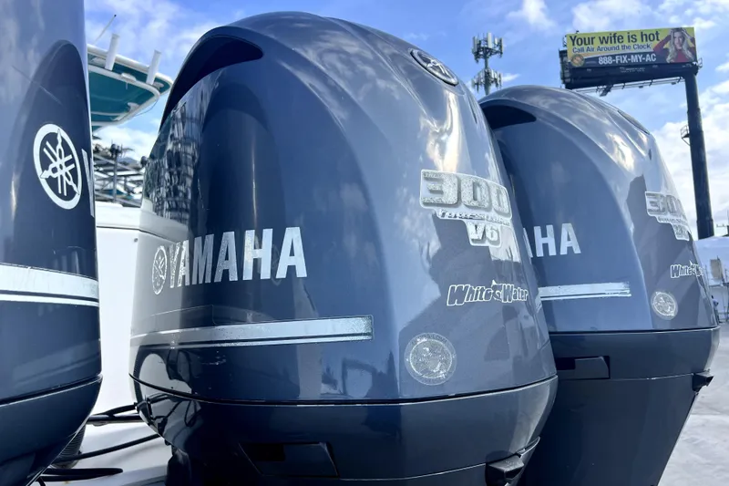 Slide: The Image of Triple Yamaha 300 V6 outboard engines on a 2012 Contender 35 LS boat. - 13