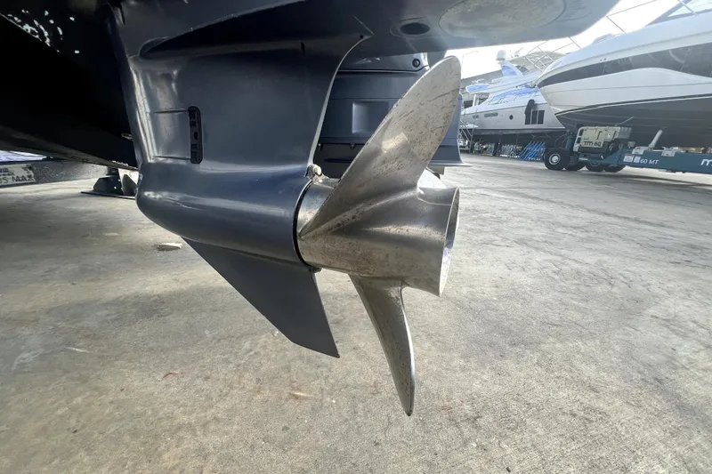 Slide: The Image of Close-up of a 2012 Contender 35 LS boat propeller on a concrete surface. - 14
