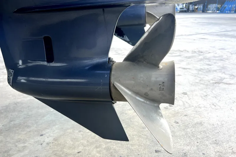Slide: The Image of Close-up of a 2012 Contender 35 LS boat propeller on a concrete surface. - 17