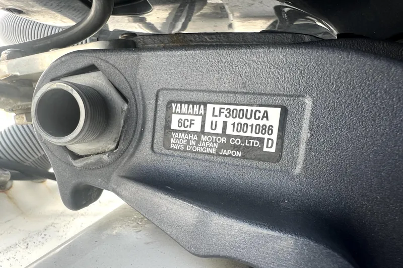 Slide: The Image of Close-up of Yamaha LF300UCA engine part on 2012 Contender 35 LS boat. - 19
