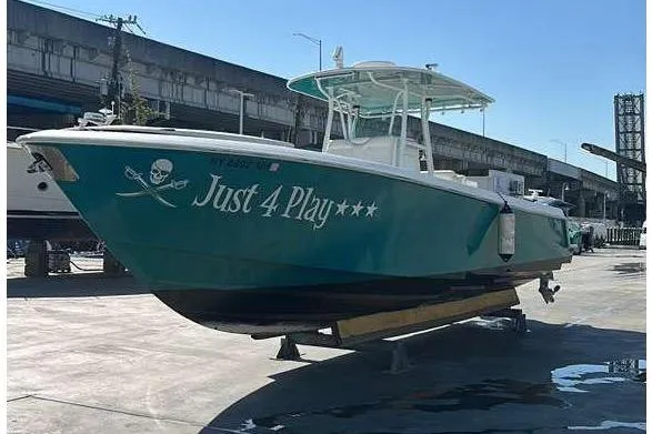 Slide: The Image of 2012 Contender 35 LS boat with "Just 4 Play" lettering. - 23