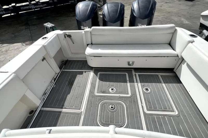 Slide: The Image of 2012 Contender 35 LS boat interior with seating and triple outboard engines. - 32