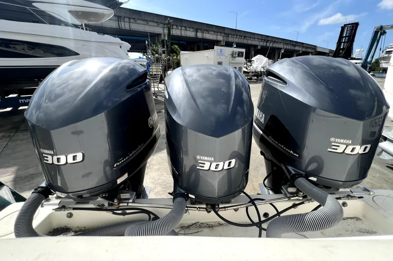 Slide: The Image of Three Yamaha 300 outboard motors on a 2012 Contender 35 LS boat. - 33