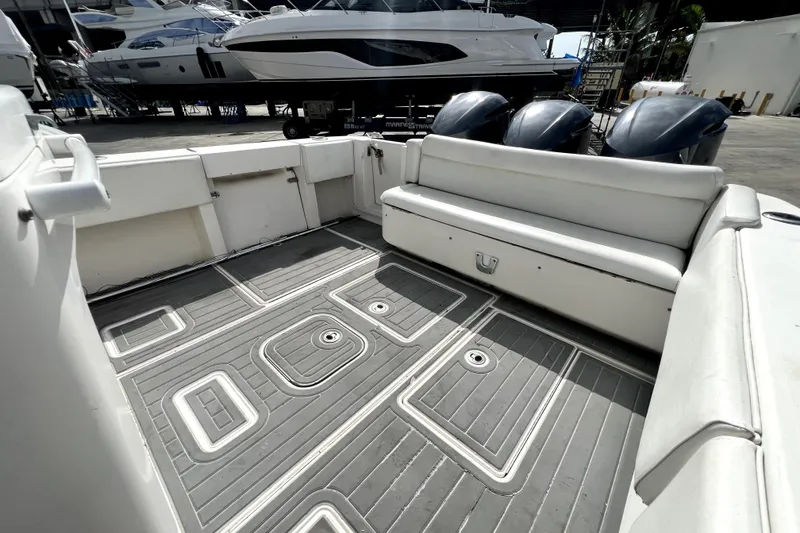 Slide: The Image of Interior view of 2012 Contender 35 LS boat with spacious seating and triple engines. - 35