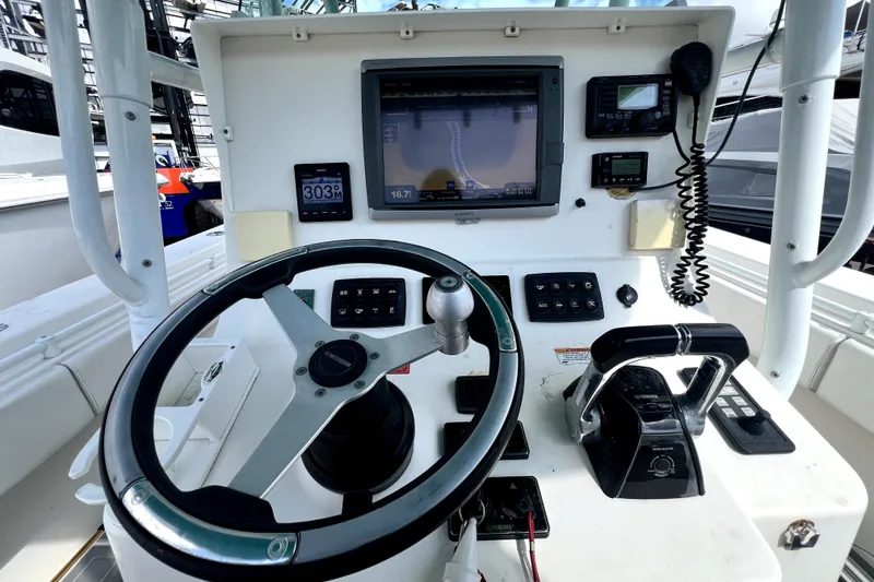 Slide: The Image of Helm of 2012 Contender 35 LS boat with navigation equipment and controls. - 38