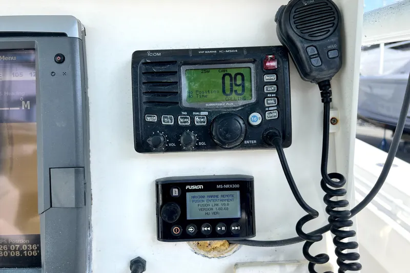 Slide: The Image of Boat dashboard with Icom radio and Fusion marine remote on a 2012 Contender 35 LS. - 40