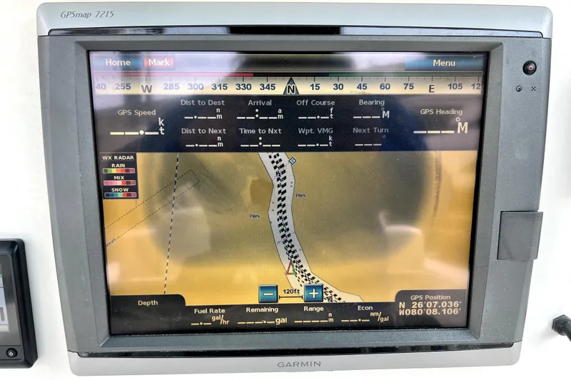 Slide: The Image of Garmin GPSmap 7215 display on 2012 Contender 35 LS boat, showing navigation and radar data. - 41