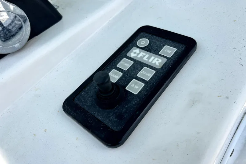 Slide: The Image of FLIR control panel on 2012 Contender 35 LS boat dashboard. - 44