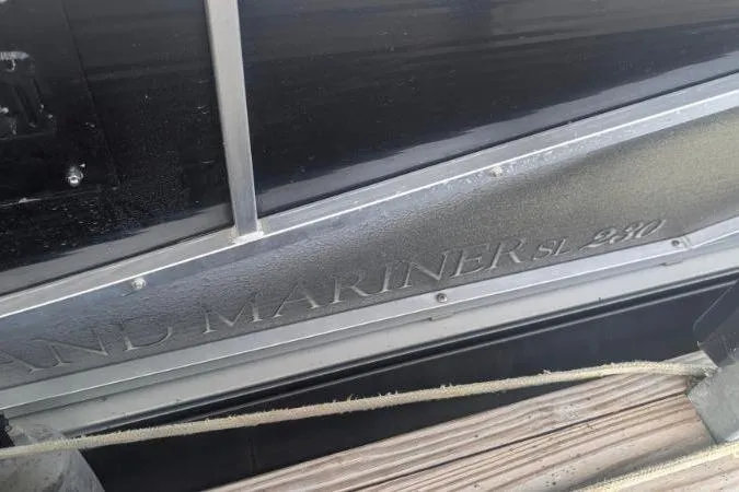 Slide: The Image of 2012 Harris FloteBote 230 Grand Mariner SEL boat side view with engraved model name. - 13