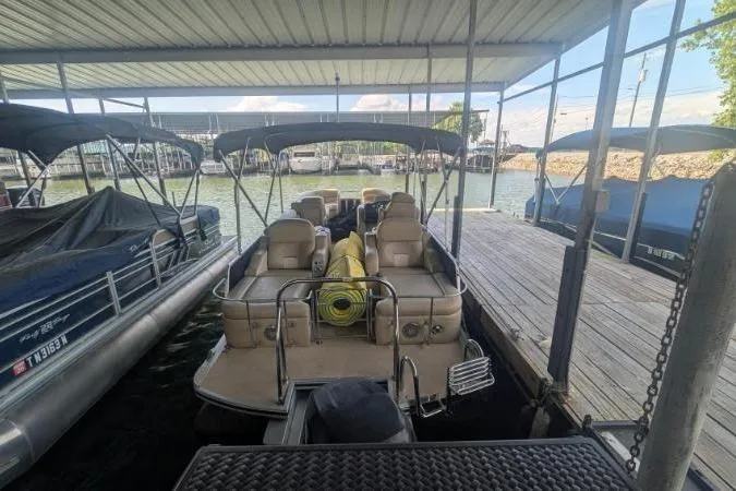 Slide: The Image of 2012 Harris FloteBote 230 Grand Mariner SEL docked at marina with covered seating. - 16