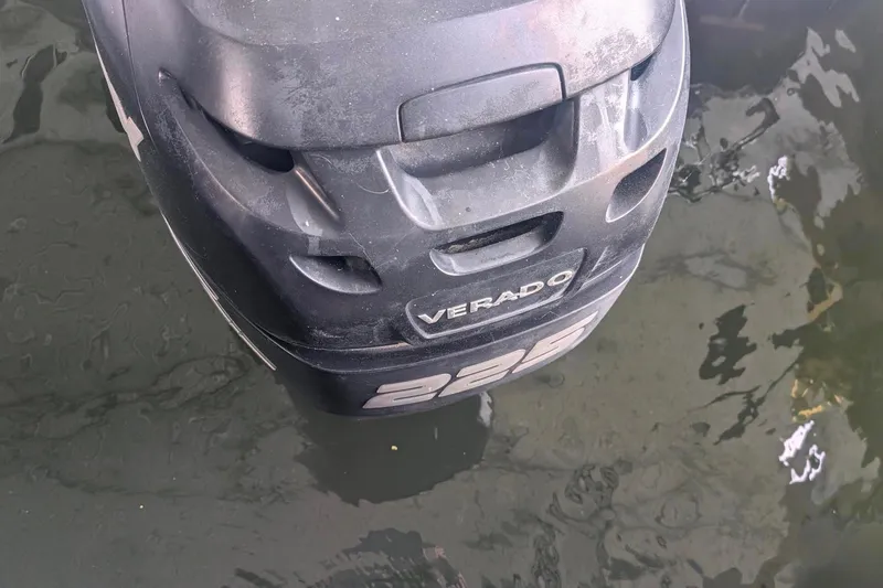 Slide: The Image of Outboard motor of a 2012 Harris FloteBote 230 Grand Mariner SEL on water. - 3