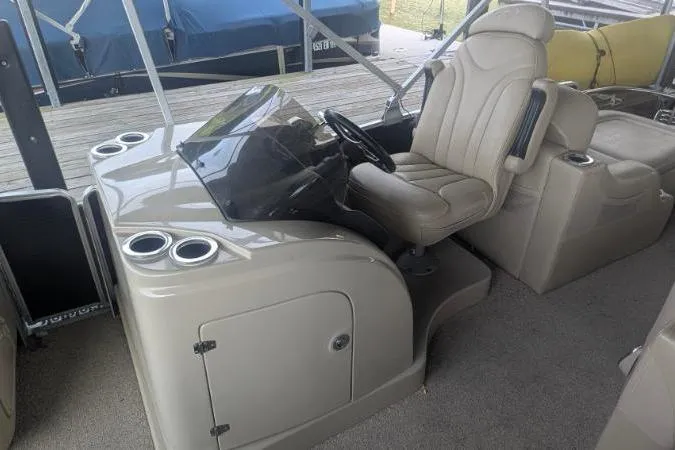 Slide: The Image of 2012 Harris FloteBote 230 Grand Mariner SEL boat interior with captain's chair and console. - 7