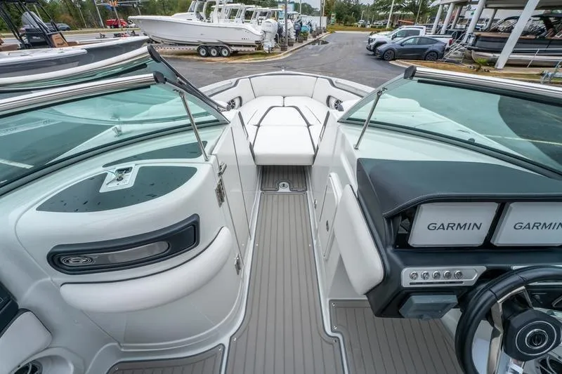 Slide: The Image of 2026 Crowline 290 XSS boat interior with Garmin navigation, sleek design, and spacious seating. - 12