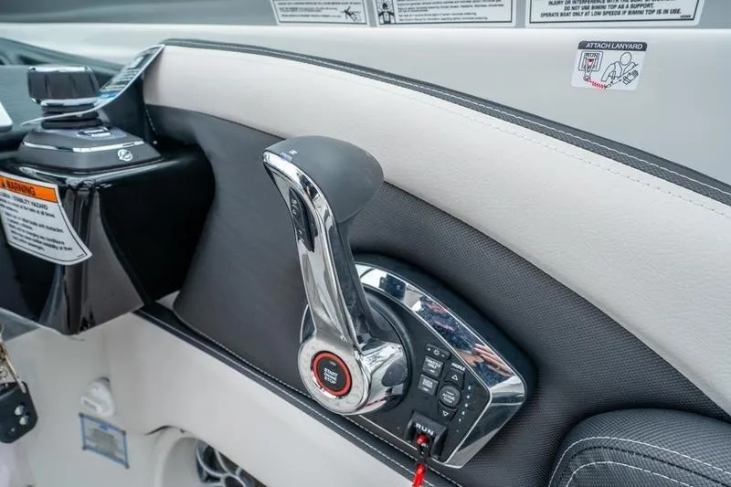 Slide: The Image of 2026 Crowline 290 XSS boat throttle control panel, featuring sleek design and modern controls. - 17