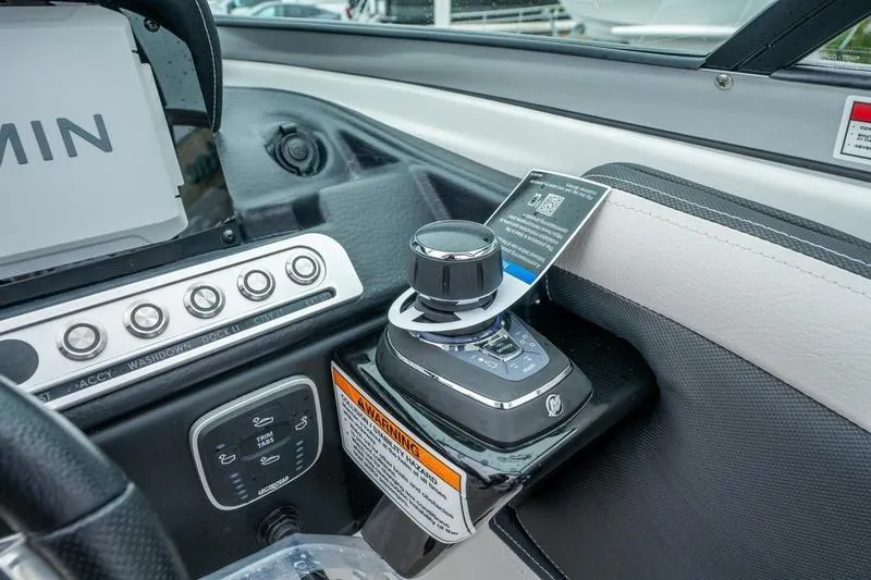 Slide: The Image of 2026 Crowline 290 XSS boat dashboard with joystick control and Garmin display. - 18